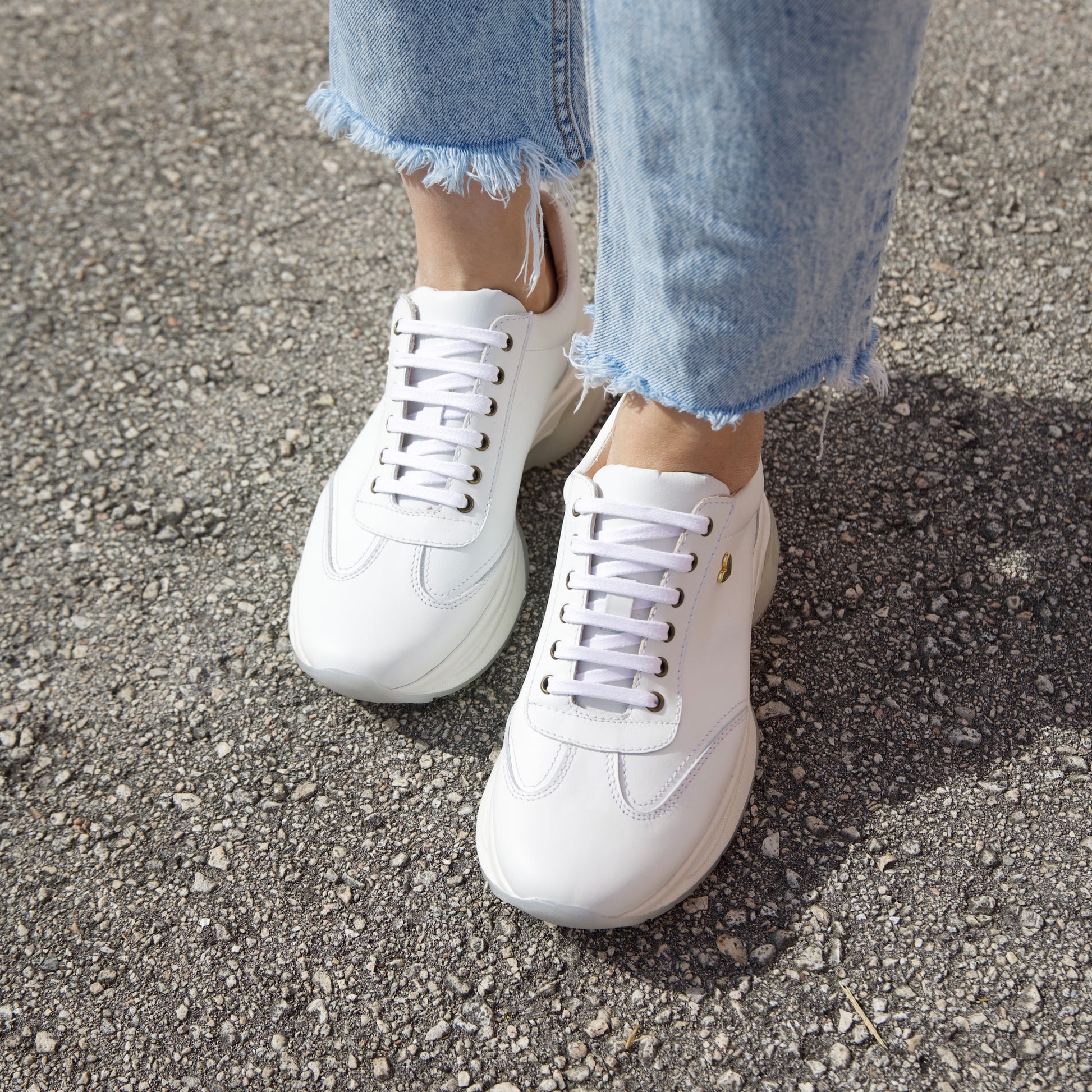 Ayra Sneakers - White by Nataly Mendez, Genuine leather upper material Genuine leather insole lining Rubber platform lining Flexible rubber outsole Handcrafted 1.5 inch heel height 1 inch platform