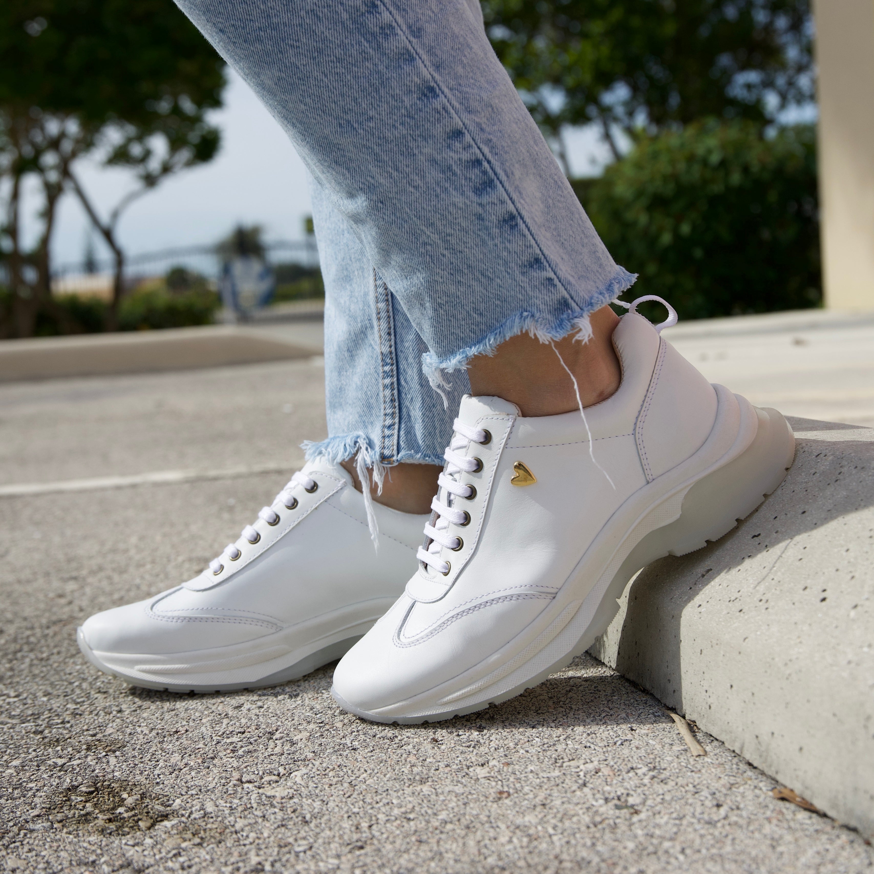 Ayra Sneakers - White by Nataly Mendez, Genuine leather upper material Genuine leather insole lining Rubber platform lining Flexible rubber outsole Handcrafted 1.5 inch heel height 1 inch platform