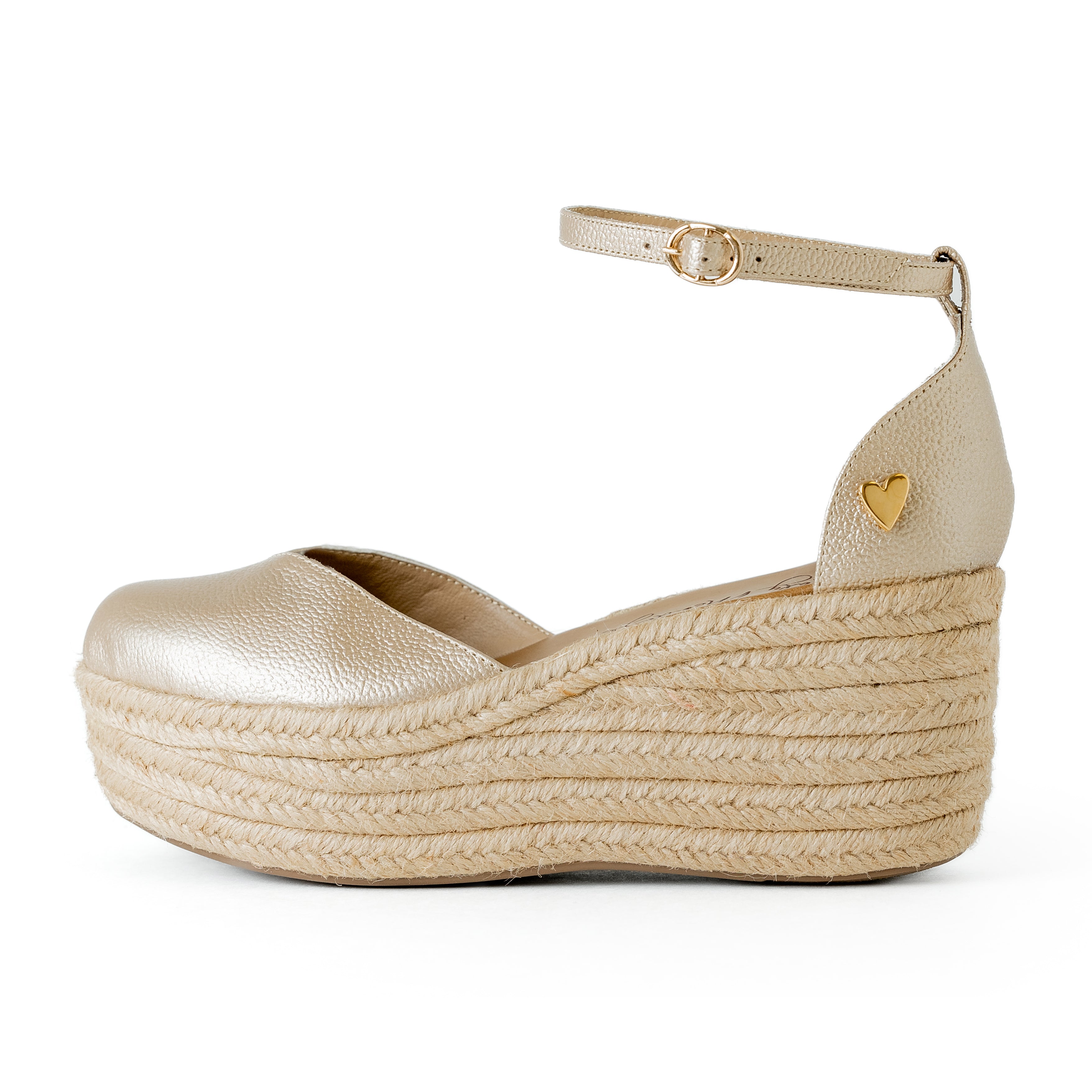 Gold Leather Espadrilles - Low High by Nataly Mendez, Natural jute base Genuine leather upper Genuine leather insole. 100% made in Colombia! 3 inch heel height 1.75 inch platform Comes with strap closure and beige hiladilla laces.