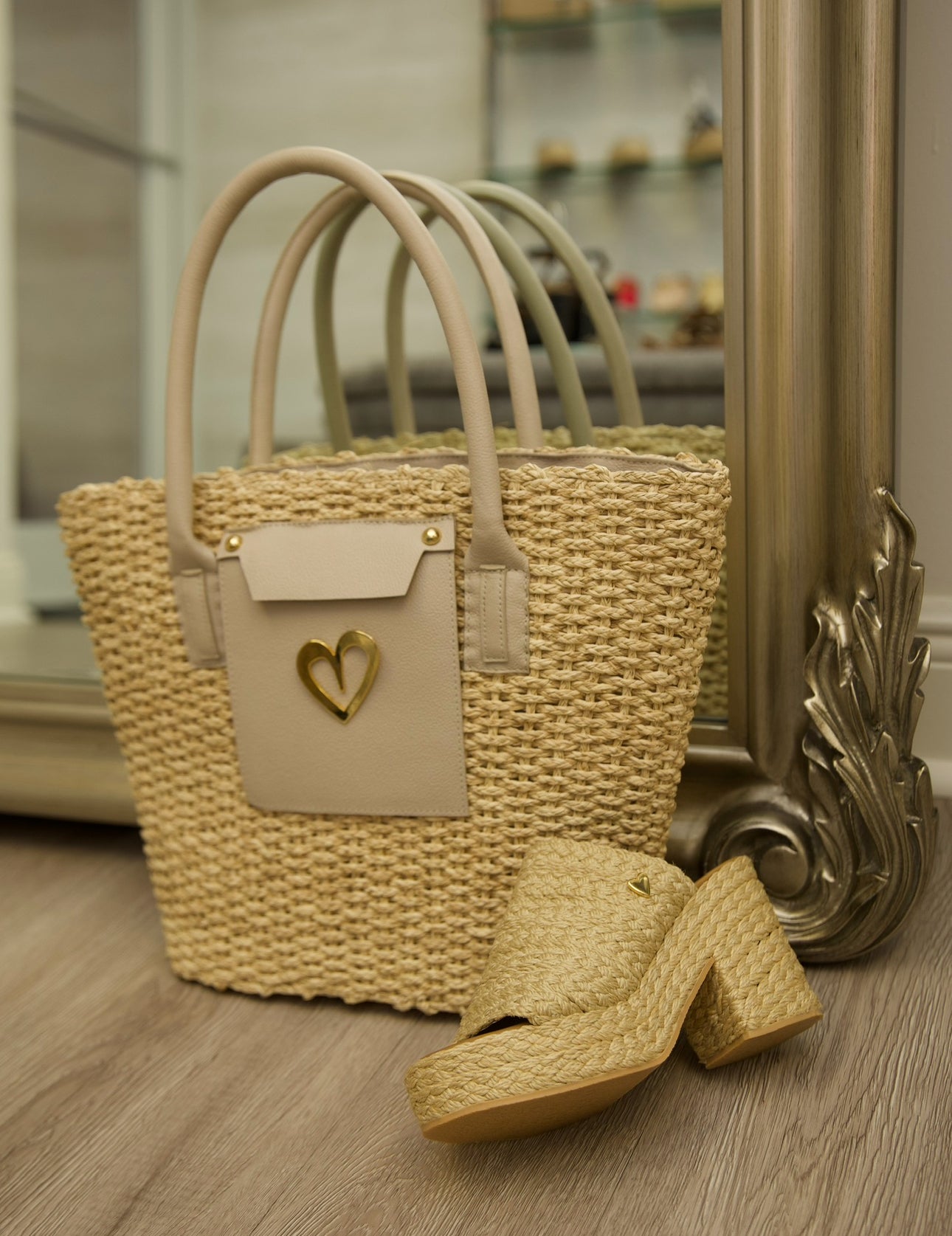 Love Beach Straw Basket by Nataly Mendez, Shell material: Natural straw and genuine leather Lining: Waterproof Genuine Leather handles Two top handles and a strap (dual use) Slip pocket and a zip pocket at the interior 12" H X 16" L x 3.5" D, 8.5" handle drop Wipe clean Handmade