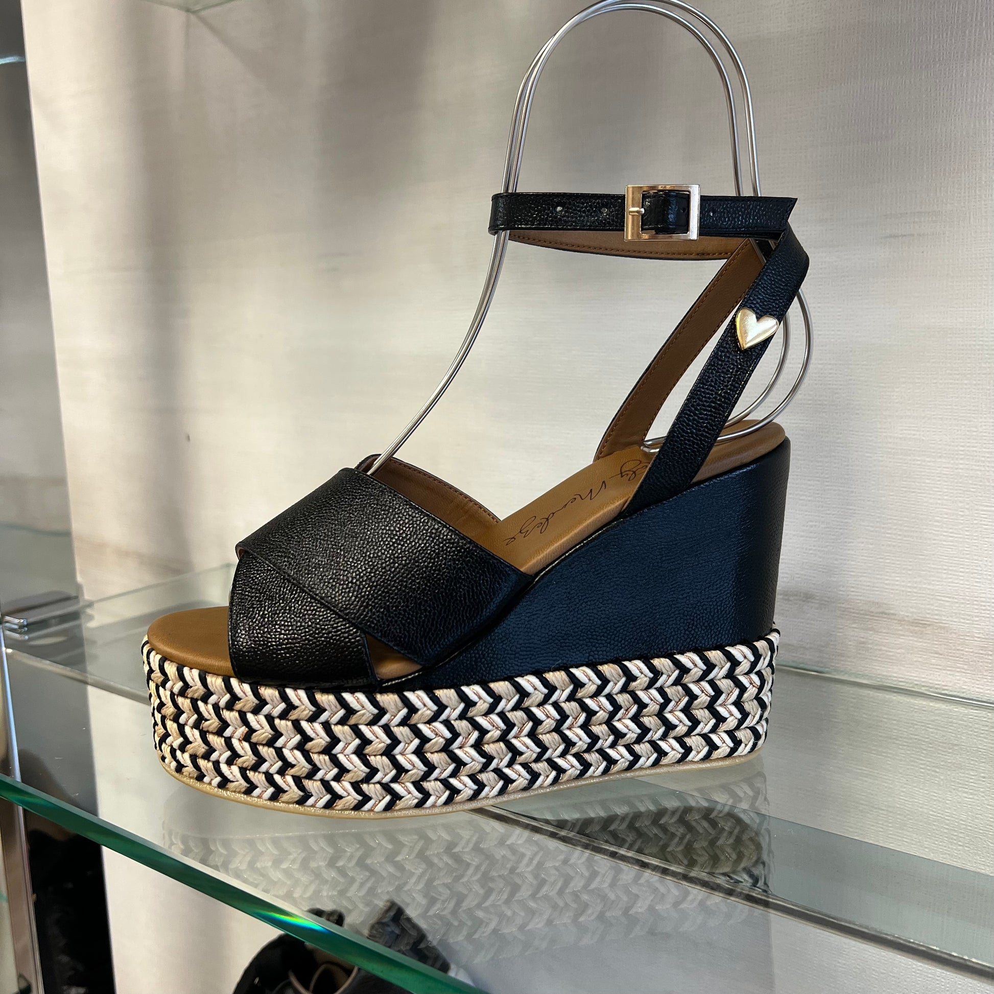Masha Sandals by Nataly Mendez FEATURES Genuine leather upper material Genuine leather insole lining Flexible rubber sole Handmade 4.75 inch high heel 1.5 inch platform