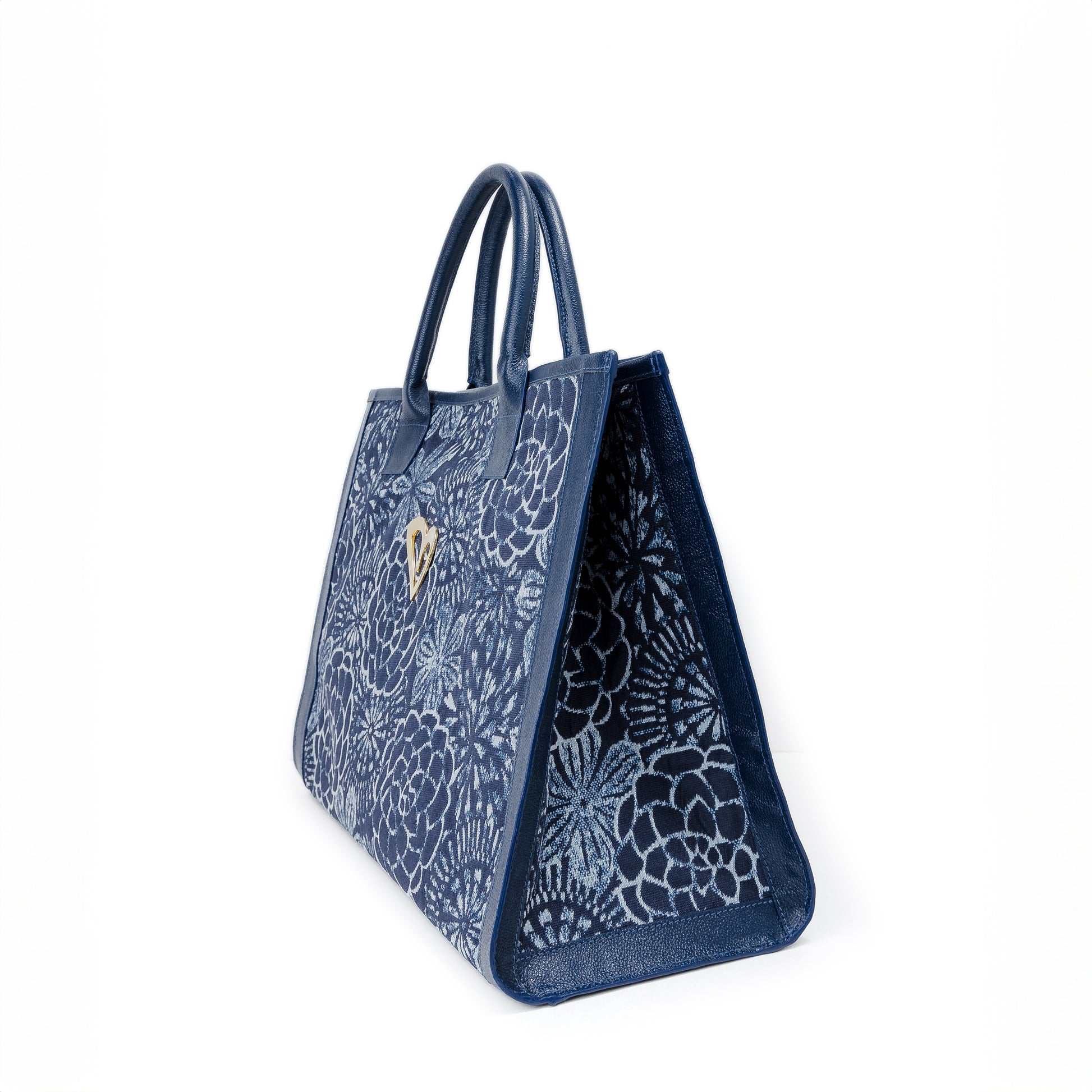 Sienna Tote Bag - Blue Flowers by Nataly Mendez, Genuine leather Fabric lining 16 x 12 x 7.5 inches (Length x Height x Width)  Handle Drop: 6"&nbsp; Magnetic snap closure Two inside pockets Gold heart