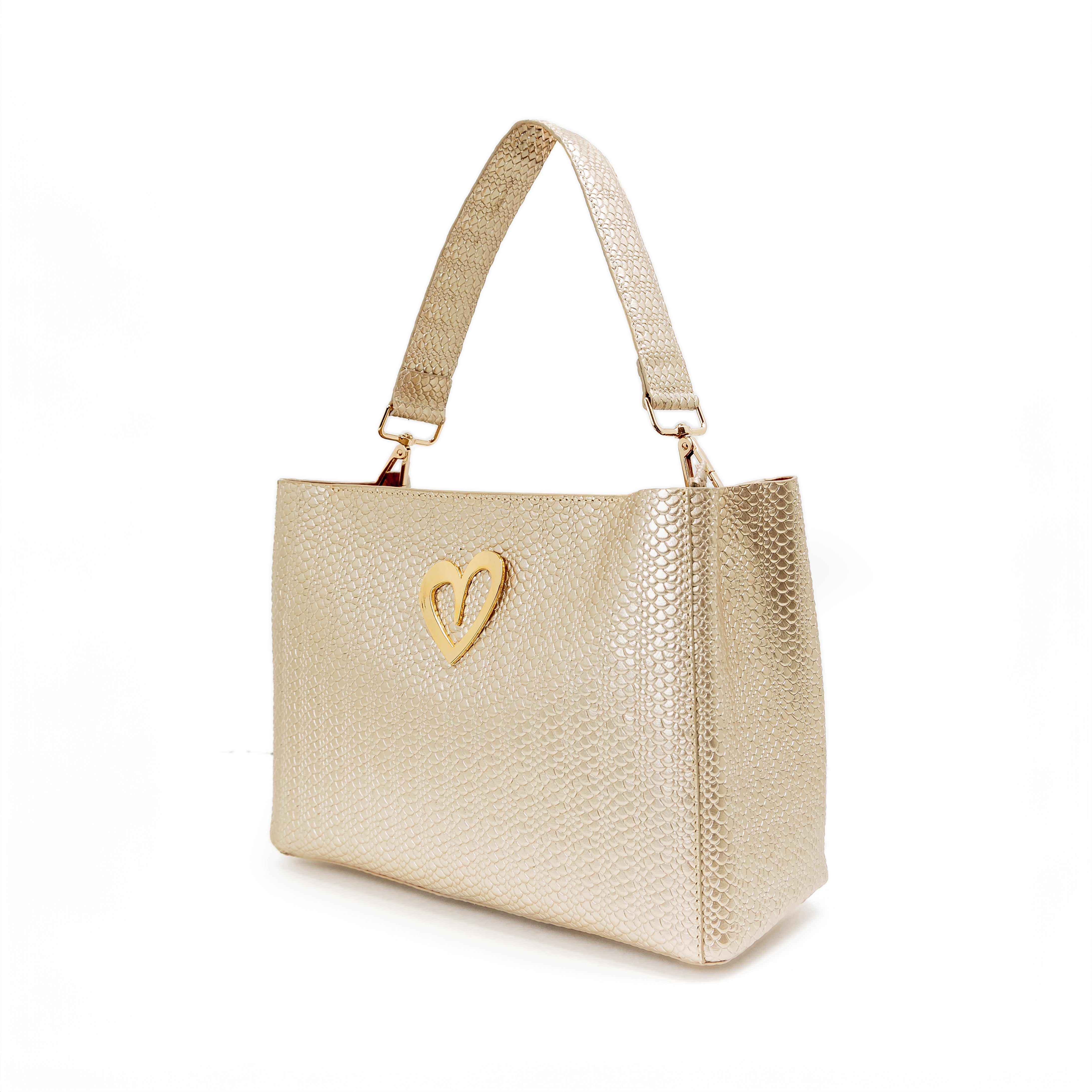 Theresa Dual Bag - Gold by Nataly Mendez, Genuine Leather Adjustable Drop in top zip closure 25 CM x 20 CM x 10 CM Gold Heart Incluye strap corto de mano y strap largo.