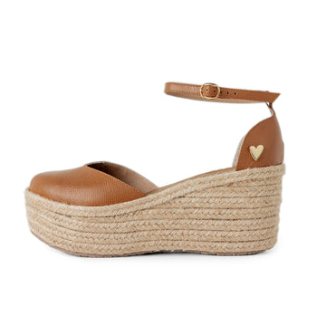 Camel Low High Espadrilles by Nataly Mendez Natural jute base Genuine leather upper Genuine leather insole. 100% made in Colombia! 3 inch heel height 1.75 inch platform Comes with strap closure and beige hiladilla laces.