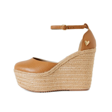 Camel Leather Espadrilles by Nataly Mendez Natural jute base Genuine leather upper Genuine leather insole. 100% made in Colombia! 4 inch heel height 1.75 inch platform Comes with strap closure and beige hiladilla laces.