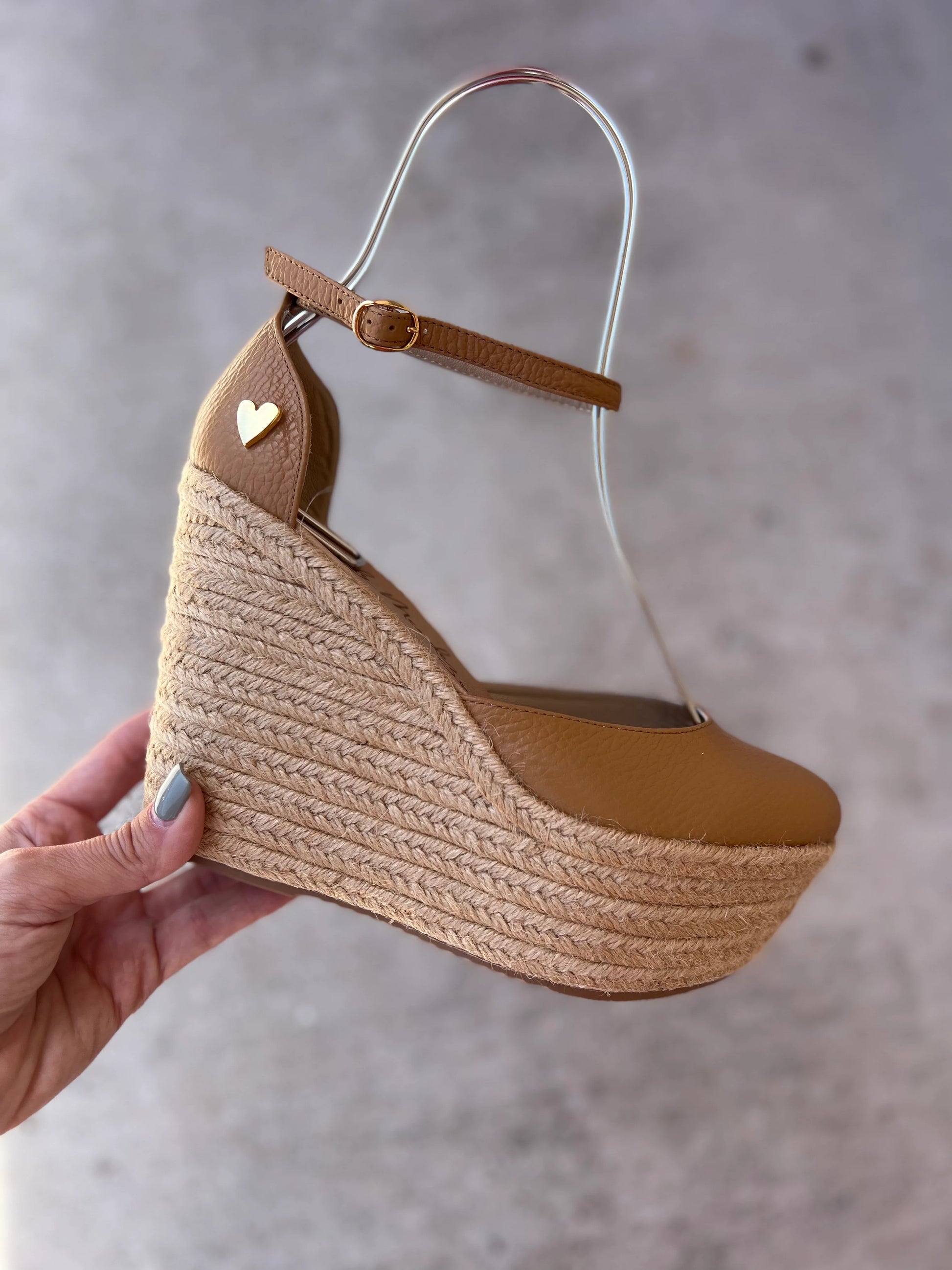 Camel Leather Espadrilles by Nataly Mendez Natural jute base Genuine leather upper Genuine leather insole. 100% made in Colombia! 4 inch heel height 1.75 inch platform Comes with strap closure and beige hiladilla laces.